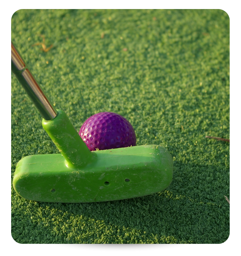 mini golf club hitting purple ball